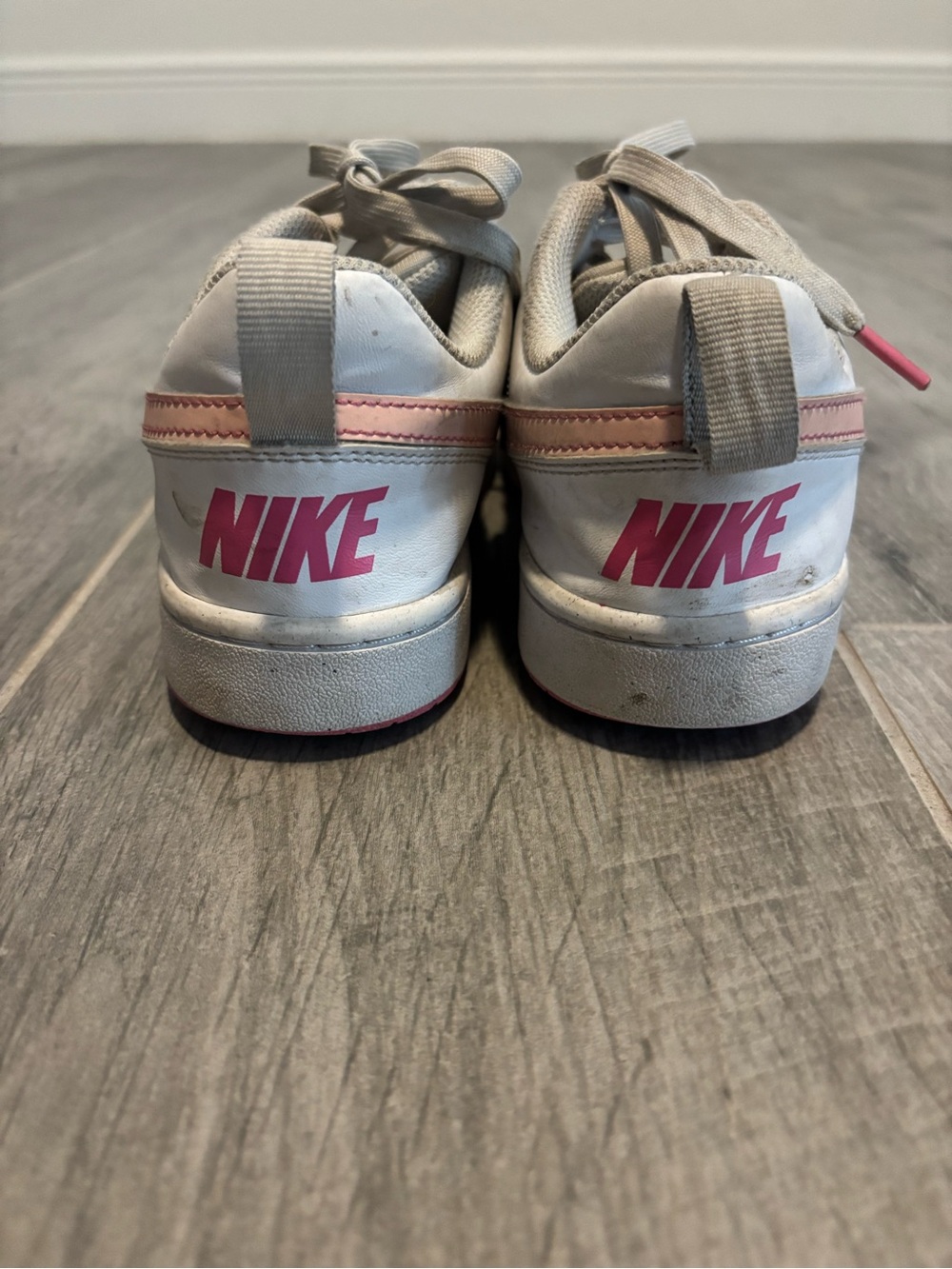 Nike Kids White Sneakers with Pink Logo Accents